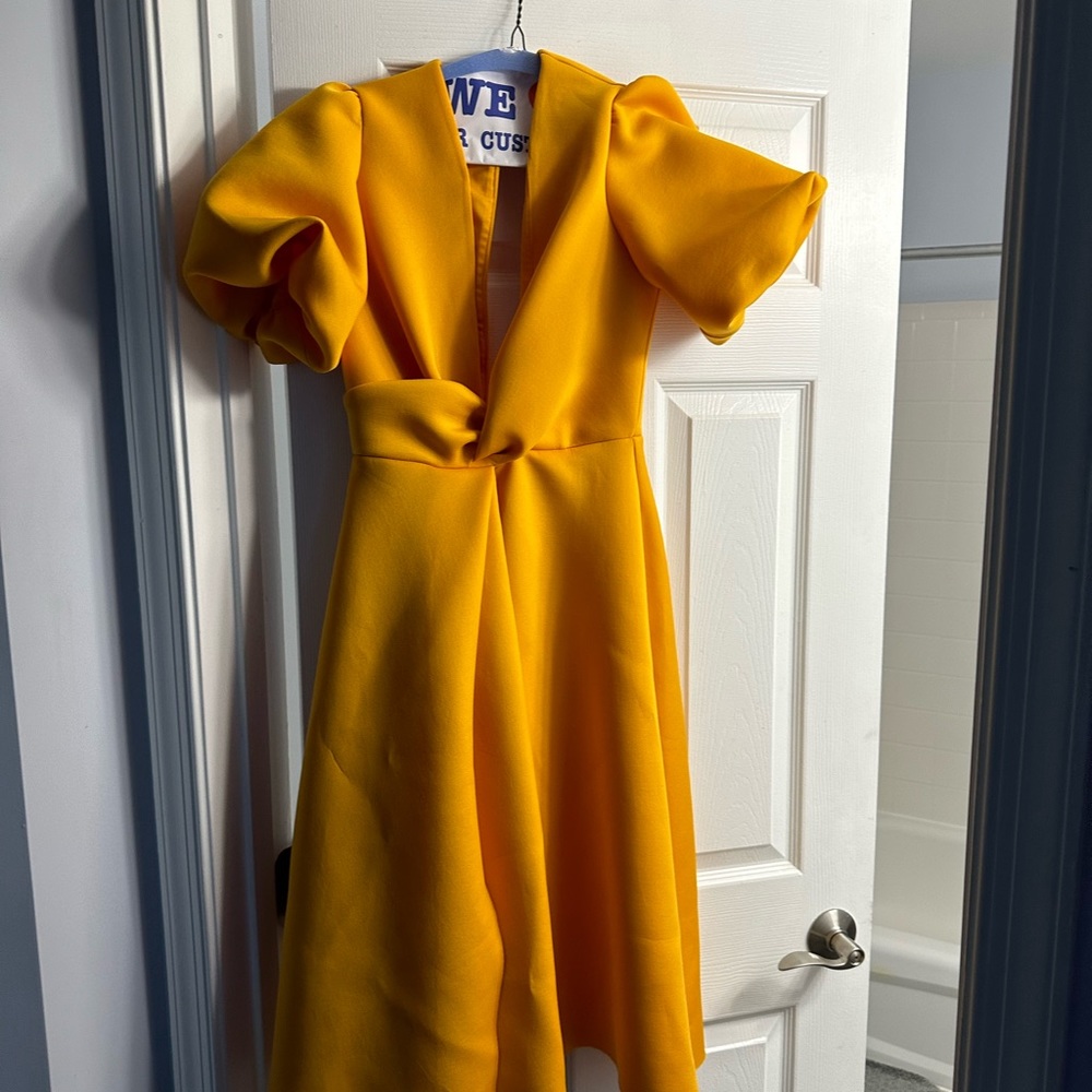 Selling three wedding dresses. Black, purple and Orange.